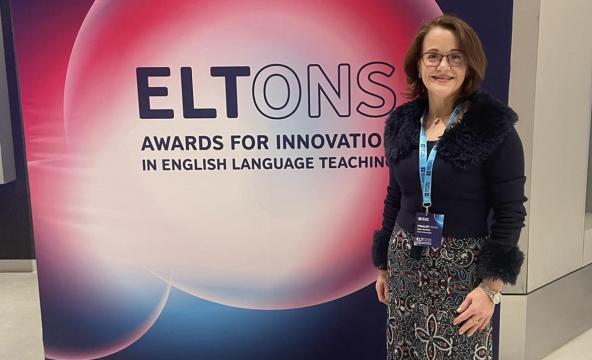 Woman in front of a poster