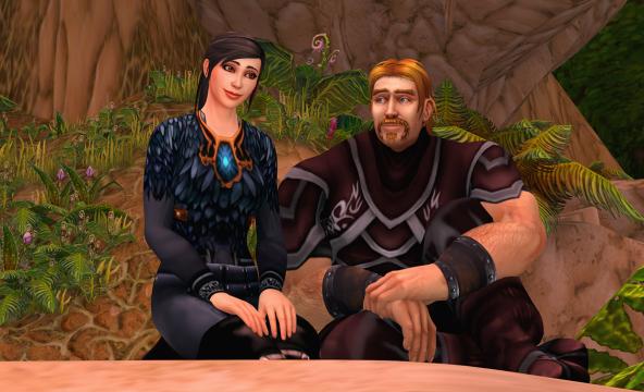 To animerte mennesker, en dame og en mann, som sitter ved et tre og prater. Foto