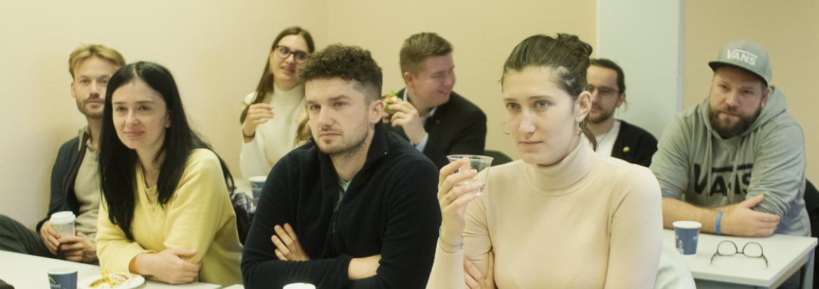 Ukrainian youth sitting at desks in a classroom during the Ukrainian Engineer meeting at Nord University