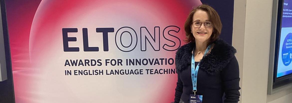 Woman in front of a poster