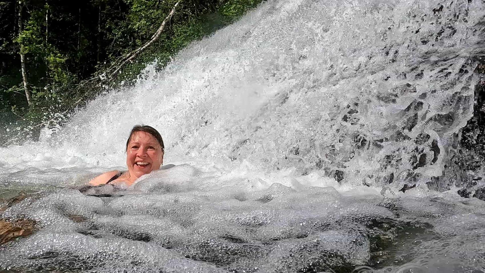 Woman swimming in cold water. Photo