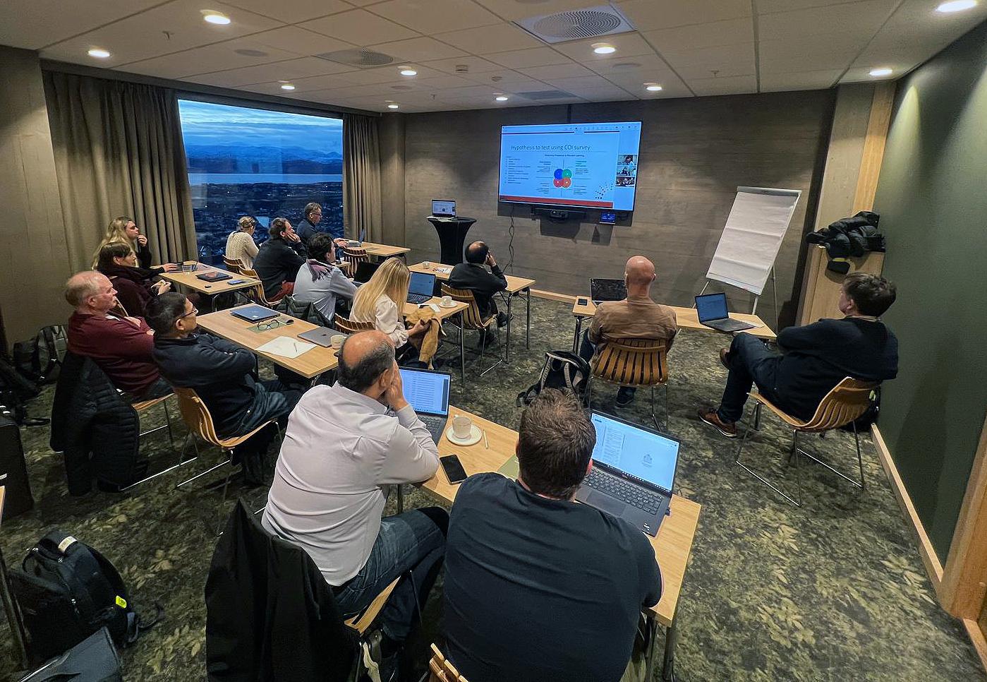 People sitting in a seminar room.