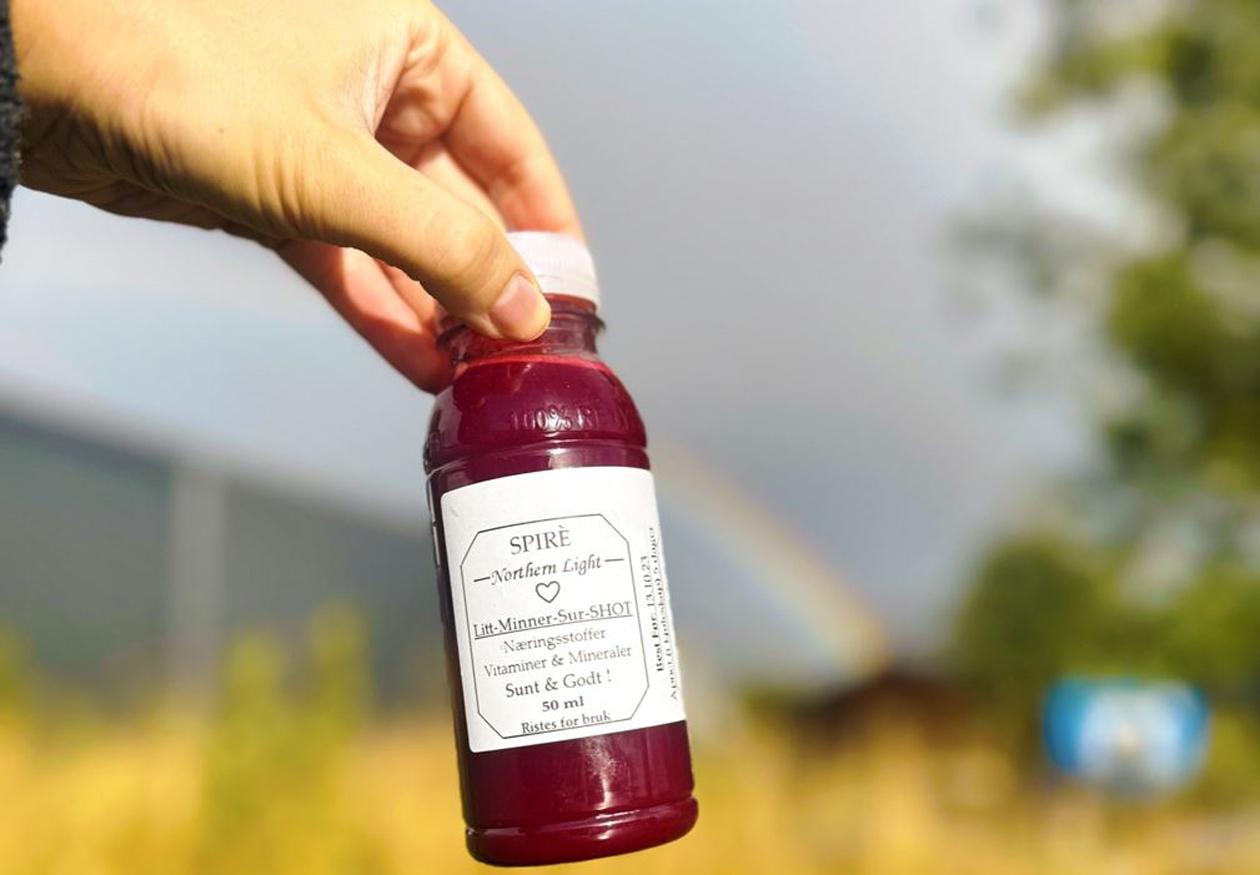 Porsjonsflaske med rød juice