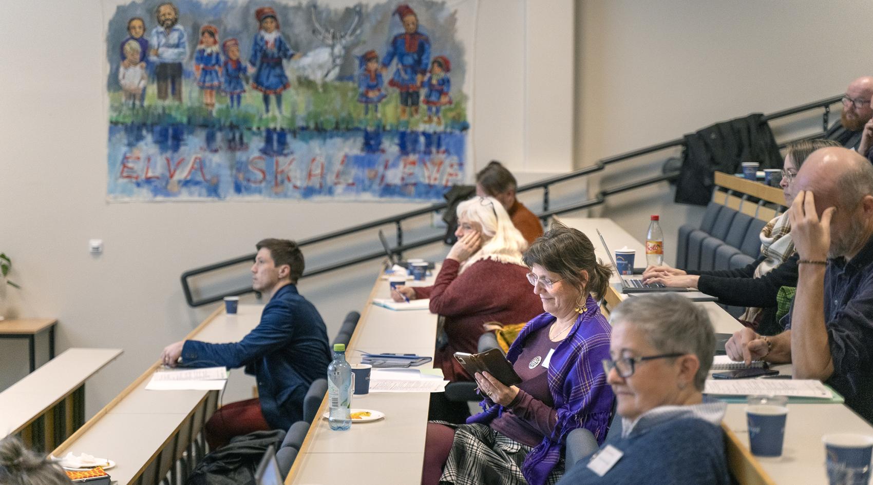 Personer i en konferansesal